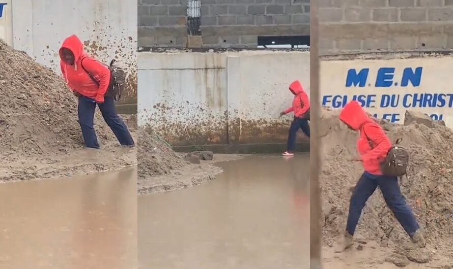 Lady gets stúck in mud, loses slipper while avoiding muddy water on street (WATCH)